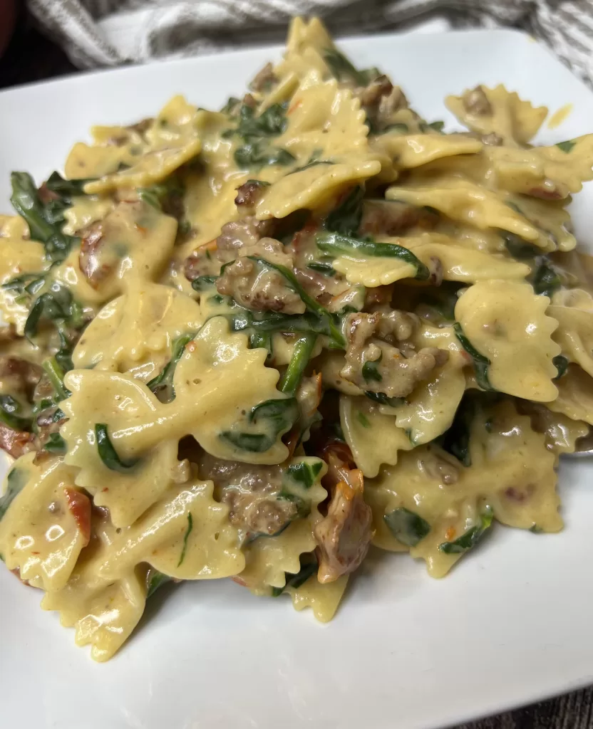 Creamy Bowtie Pasta with Italian Sausage, Sundried Tomatoes and Spinach