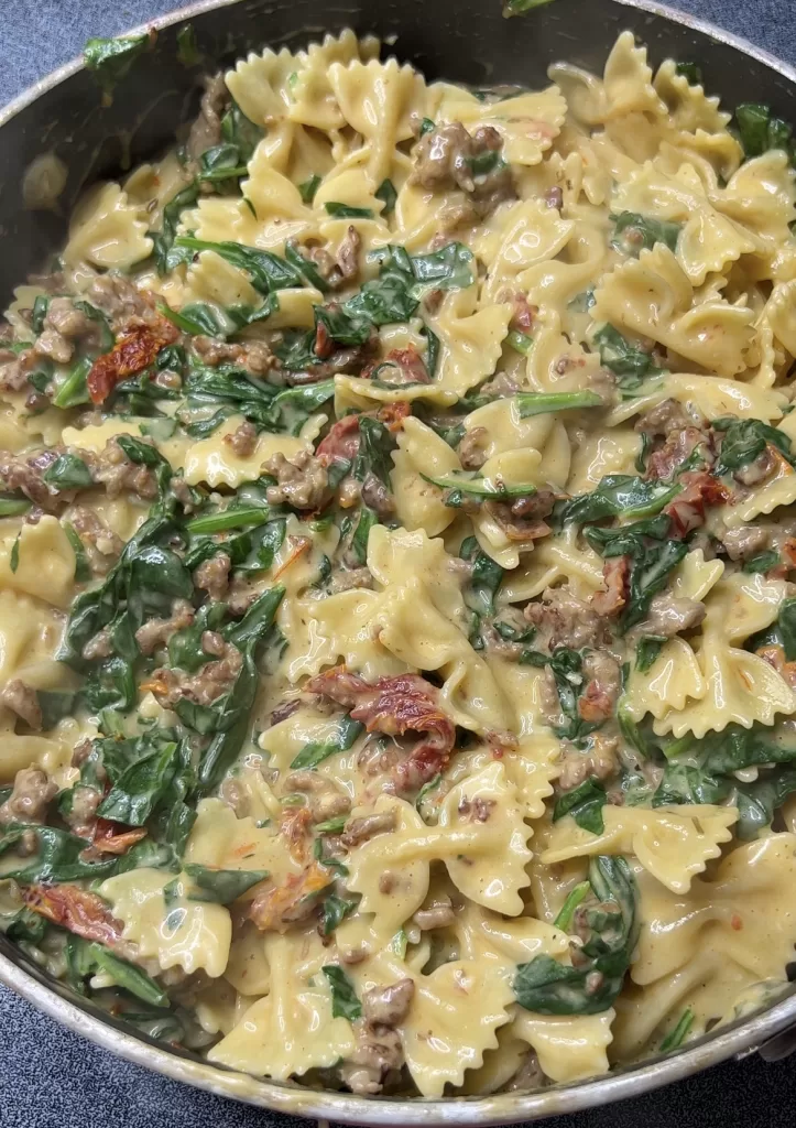 Creamy Bowtie Pasta with Italian Sausage, Sundried Tomatoes and Spinach
