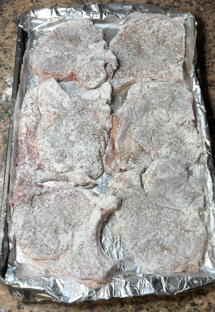 dredged and seasoned pork chops